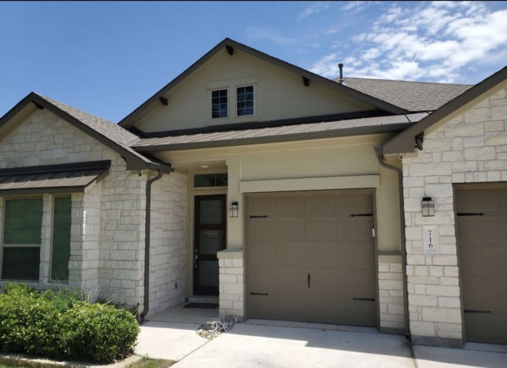 Stone home with professionally installed gutter system